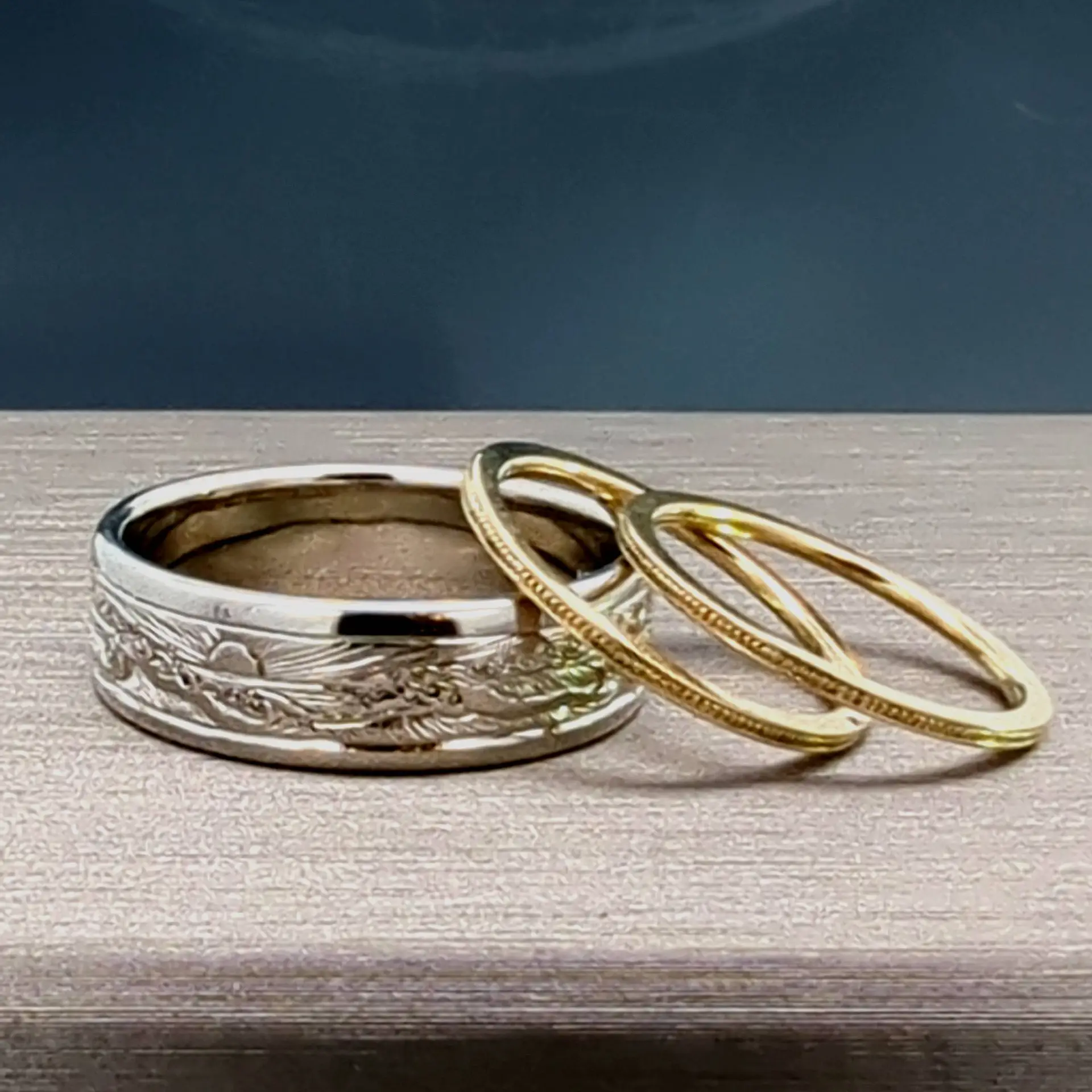 By the Sea the waves roll in on this hand engraved wedding band