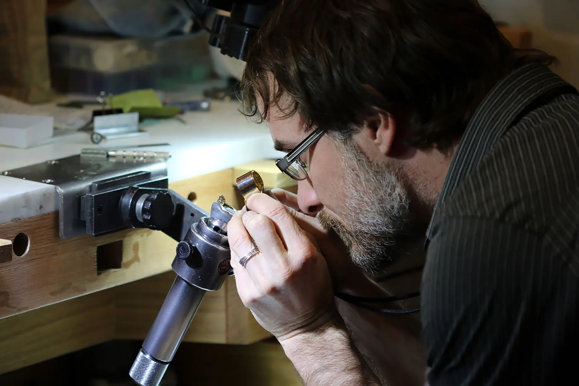 Ben Stewart working on hand-engraved jewelry in the Modern Heirloom studio