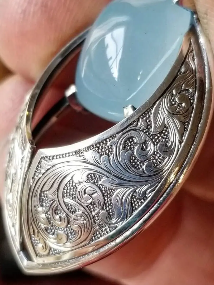 Hand scroll engraved Relic Series Modern Heirloom®amulet by Ben Stewart with aquamarine in silver.
