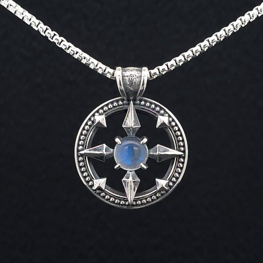 Modern Heirloom® Pendant with lunar and compass symbolism.