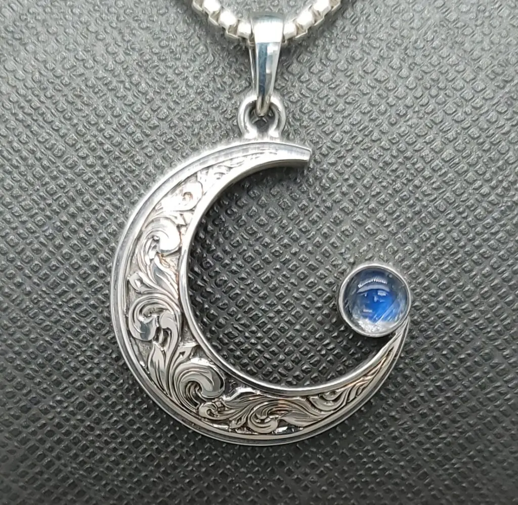 Crescent moon scroll necklace handcrafted in Manteo, NC