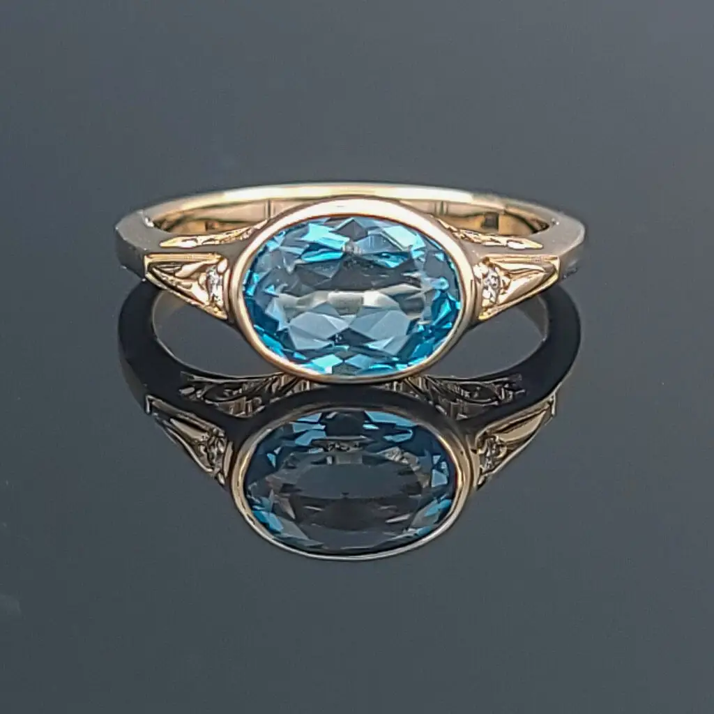 14k yellow gold tulip-inspired ring with 9x7mm topaz gemstone